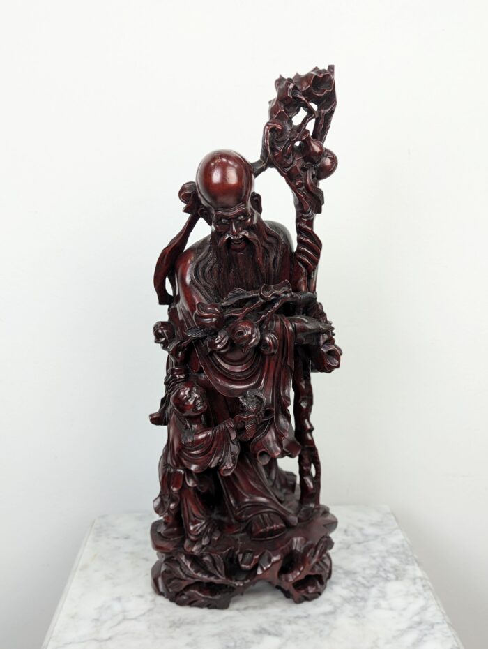 Carved rosewood oriental statue